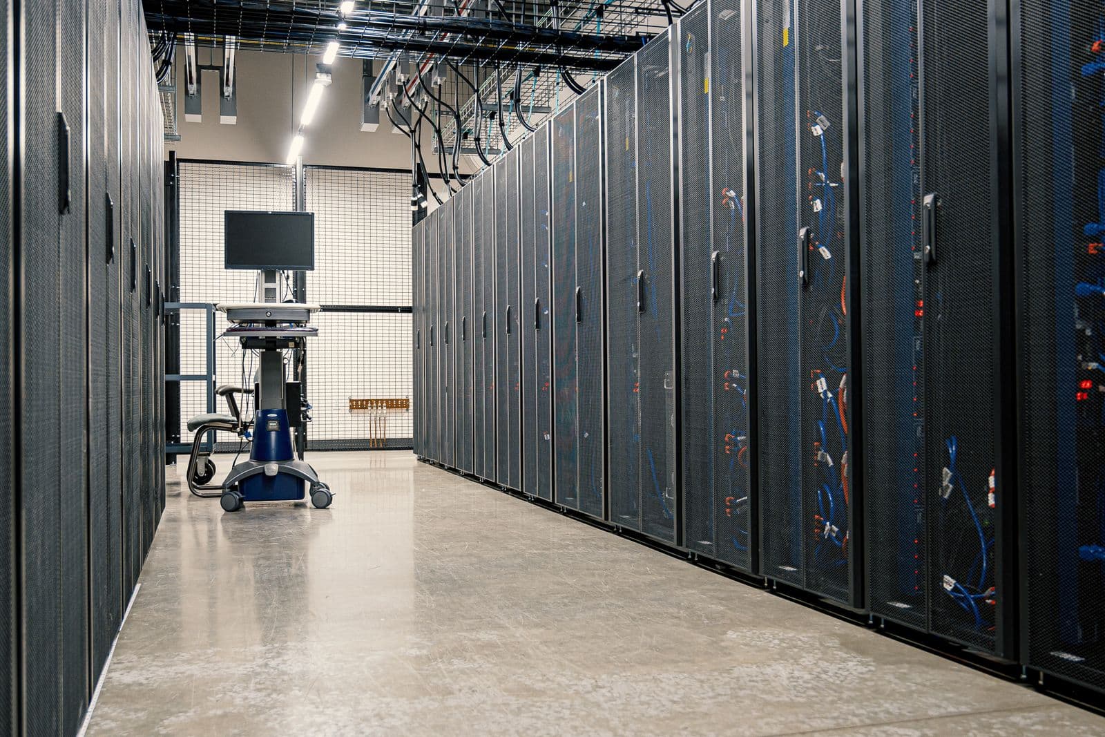 A corridor of server racks in an enterprise data centre